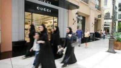 Shoppers buying luxury items at retailers such as Gucci have begun to curtail their spending