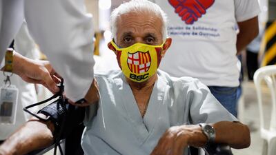A man gets his vital signs checked by a doctor before entering to get a dose of the coronavirus disease (COVID-19) vaccine during a mass vaccination programme for the elderly, at the Bolivarian Technology Institute, in Guayaquil, Ecuador. Reuters