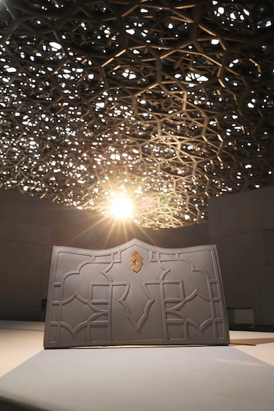 Inspired by the famous dome of Louvre Abu Dhabi, designed by Jean Nouvel, the clutch’s geometric pattern echoes the museum’s 'rain of light' effect. Photo: Louvre Abu Dhabi
