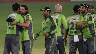 Lahore Qalandars' David Wiese, second left, congratulates teammates after they beat Multan Sultans during the second PSL qualifier at National Stadium in Karachi on Sunday. AP