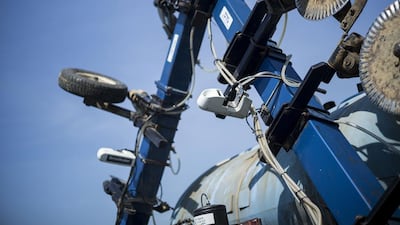 A sensor is seen attached to a tractor drawn liquid fertiliser applicator at the Little Bohemia Creek farm in Warwick, Maryland. Technologies such as GPS and auto-steering have become the norm in mechanized farming in the United States and other countries. Brendan Smialowski / AFP