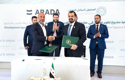 Arada chief executive Ahmed Alkhoshaibi, left, shakes hands with Mohammed Al Khayyat, chief executive of the Real Estate Development Sector at the Syrian Sovereign Fund. Photo: Arada