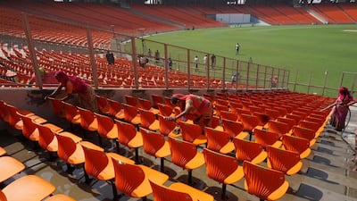 Workers clean the Sardar Patel Stadium, the world's biggest cricket stadium. AFP