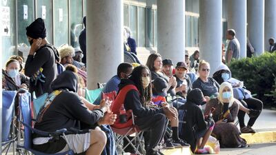 Hundreds of unemployed Kentucky residents wait in long lines outside the Kentucky Career Centre for help with their unemployment claims in June. AFP.