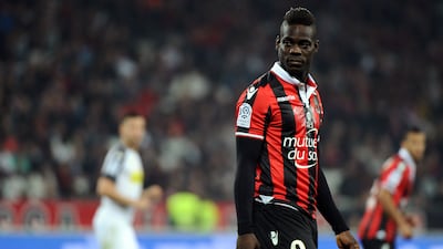 (FILES) This file photo taken on May 14, 2017 shows Nice's Italian forward Mario Balotelli looking on during the French L1 football match between Nice and Angers at the Allianz Riviera stadium in Nice, southeastern France. Italian international striker Mario Balotelli is determined to stay at Ligue 1 outfit Nice next season, club president Jean-Pierre Rivere revealed on June 22, 2017. / AFP PHOTO / Franck PENNANT