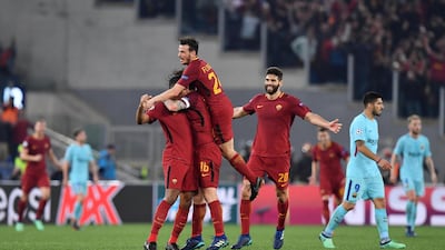 Roma players celebrate victory over Barcelona at the end of their Uefa Champions League quarter-final second-leg match in Rome. Ettore Ferrari / EPA