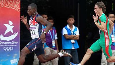 British sprinter David Bolarinwa, left, sprints to victory in his heat of the 100m at the Youth Olympics yesterday.