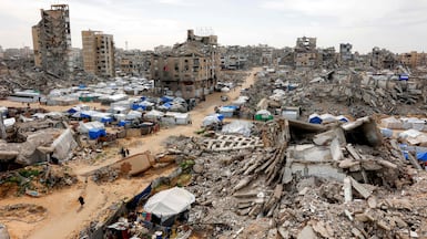 Destruction in the Muqusi area of Gaza city. Ninety members of the woman's family were killed in the Gaza war. AFP