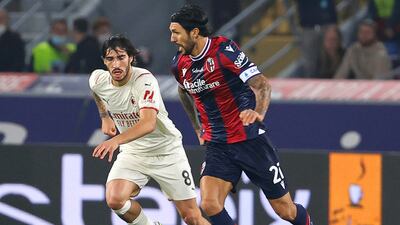 Bologna's Roberto Soriano and Milan's Sandro Tonali in action. EPA
