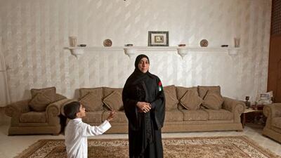 Taqia Al Shehhi, pictured with her youngest son Ali, now lives in Al Hamadiya, Ajman.