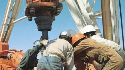 Oil workers on a drilling rig in 1968. Adnoc Drilling is now the largest drilling company in the Middle East, with a fleet of 96 rigs. Courtesy Adnoc Drilling