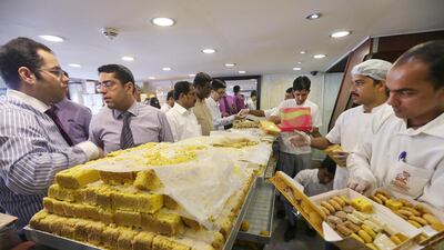 People buying sweets ahead of Diwali at Puranmal sweet shop in Karama, Dubai. Pawan Singh / The National