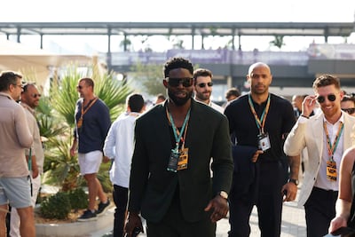 Former footballers Micah Richards and Thierry Henry at Yas Marina during race weekend. Chris Whiteoak / The National