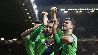 Charlie Austin celebrates with team mates after scoring the first goal for Southampton. Reuters / Andrew Yates