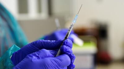 A healthcare worker holds a syringe with the Pfizer-BioNTech COVID-19 vaccine at the University Hospital in Nitra, Slovakia. Reuters