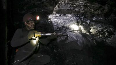 A miner works at the Gorniak 95 coal mine in Makiyivka, near Donetsk. Local miners descend to depths of up to 1,300 metres and often work in temperatures nearing 40oC. Maxim Zmeyev / Reuters
