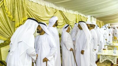 Men gather to pay their respects to the family of Captain Ahmed Khalifa Al Baloushi, 27, a UAE soldier who died in a helicopter crash while serving in Yemen, at a majlis outside the Al Towayya mosque in the Al Towayya area of Al Ain on August 13, 2017. Christopher Pike / The National
