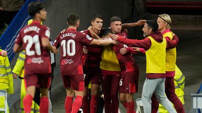Erik Lamela celebrates with Sevilla teammates after scoring against Real Madrid. AP