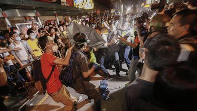 Hong Kong police use pepper spray on pro-democracy protesters during a clash with protesters in the Mong Kok District of Hong Kong. Rolex Dela Pena/ EPA