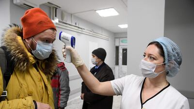 Medical staff checks a media representative in one of the buildings of Spasokukotsky clinical hospital in Moscow. AFP