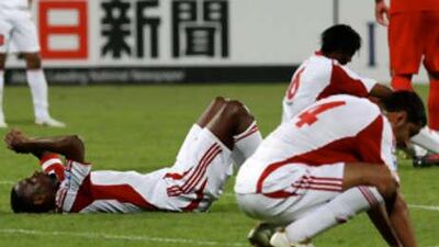 UAE players are dejected after their draw with Iran.