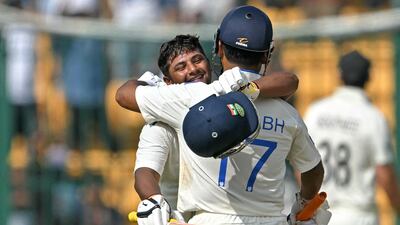 Sarfaraz Khan celebrates with Rishabh Pant after reaching 150. AFP