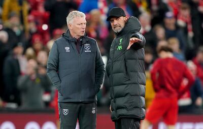 West Ham United manager David Moyes, left, speaks with Liverpool manager Jurgen Klopp. PA