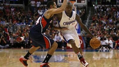 Los Angeles Clippers' Jamal Crawford looks for a way past Atlanta's Devin Harris