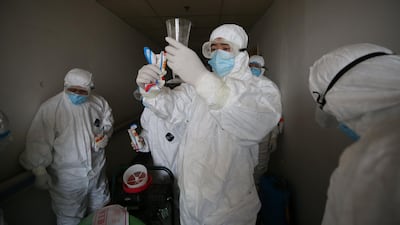 Workers prepare to disinfect rooms at the Red Cross hospital in Wuhan, in China's central Hubei province earlier in the week. AFP