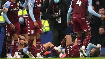 Aston Villa's Lucas Digne and Matty Cash after being hit by a bottle at Goodison Park. PA