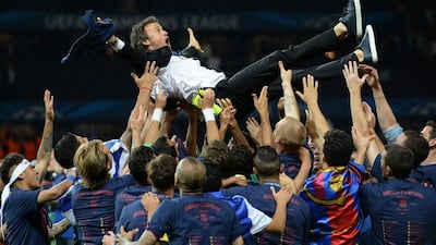 Barcelona players throw coach Luis Enrique into the air after the Uefa Champions League final win over Juventus at the Olympic Stadium in Berlin, Germany, 06 June 2015. EPA/ANDREAS GEBERT