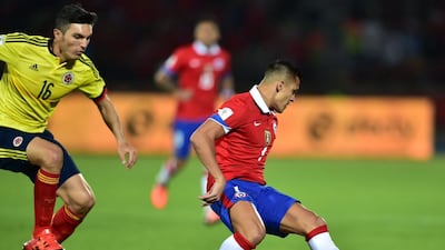 Chile’s Alexis Sanchez controls the ball next to Colombia’s Daniel Torres during their 2018 World Cup qualifying match on Thursday night. Martin Bernetti / AFP