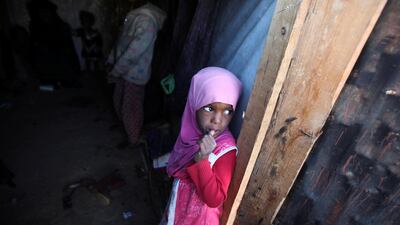 A girl stands in her family's hut at a camp for internally displaced people in Khamir of the northwestern province of Amran, Yemen. Reuters