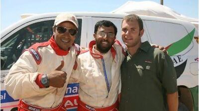 Abdullah al Huraiz, centre, with his co-driver Khalid Ahmad Bilal Abdulla, left, hopes to secure outside funding to run the Dakar again next year.