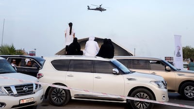 A helicopter flies over.