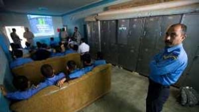 Iraqi policemen attend a lesson on human rights in Bushariyah, south of Kirkuk.