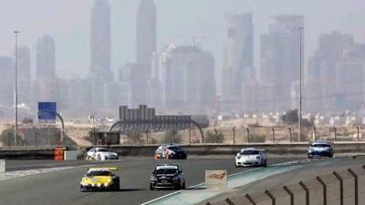 Drivers head towards the final turn during the 24 Hours of Dubai endurance race, an event that attracts worldwide competitors to the UAE. Jeff Topping / The National