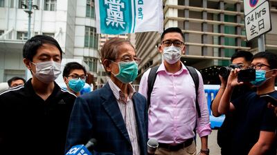 Pro-democracy activist Martin Lee, 81, talks to the media outside the Central District police station in Hong Kong on April 18, 2020. AFP