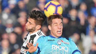 Juventus' Uruguayan midfielder Rodrigo Bentancur (L) and Atalanta's Croatian midfielder Mario Pasalic go for a header during the Italian Serie A football Match Atalanta Bergamo vs Juventus at the Atleti Azzurri d'Italia stadium in Bergamo. AFP