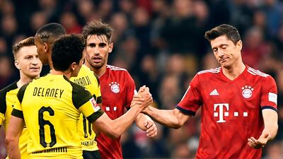 Robert Lewandowski, right, and his Bayern Munich side lead the Bundesliga table with nine games of the season remaining. EPA