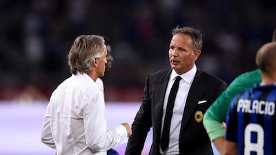 Inter Milan’s Roberto Mancini, left, and AC Milan’s Sinisa Mihajlovic will face of at the San Siro tomorrow. Claudio Villa / Getty Images