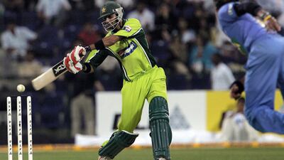 Pakistan batsman Shoaib Malik hits the ball off India fast bowler Shanthakumaran Sreesanth. AFP