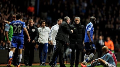Paul Lambert manager of Aston Villa and Jose Mourinho manager of Chelsea in discussion after Ramires of Chelsea, second from right, challenges Karim El Ahmadi of Aston Villa, right, during their Premier League match on March 15, 2014 in Birmingham, England. Chris Brunskill/Getty Images
