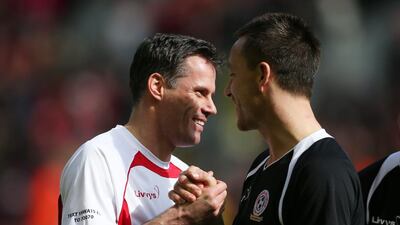 John Terry and Jamie Carragher shake hands before the match. Alex Morton / Reuters