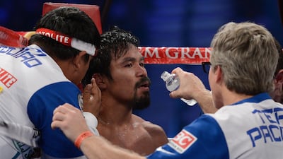 rainer Freddie Roach gives Manny Pacquiao instructions during his 2012 bout against Timothy Bradley. Getty