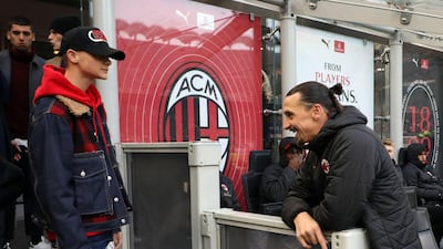Milan's Zlatan Ibrahimovic chats with one of his sons. EPA