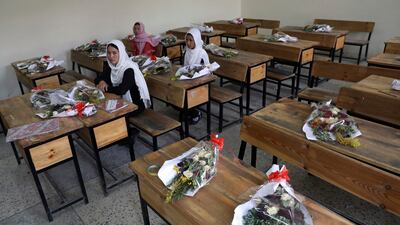 Kabul schoolgirls pay tribute to those killed in a May bombing of the Syed Al Shahda girls school. The UN said that more women and children were killed and wounded in Afghanistan in the first half of 2021 than in any year since the UN began keeping count in 2009. AP