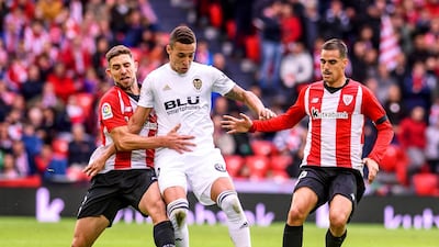 Valencia's Rodrigo Moreno in action against Athletic Bilbao players Yeray Alvarez and Dani Garcia. EPA