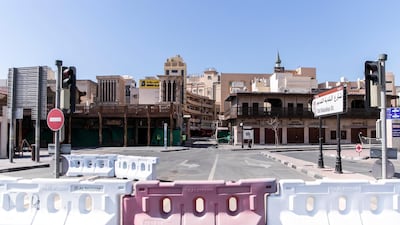 The entrance to the famous gold souq was barricaded on Tuesday. Shopkeepers and residents must remain in their homes for two weeks. All photos by Reem Mohammed / The National