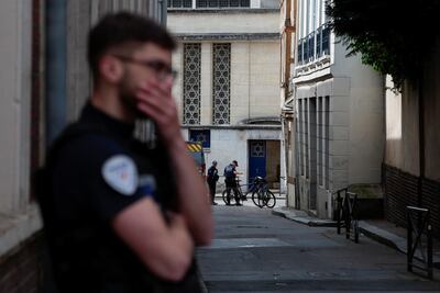 French police stand guard after officers shot dead an armed man earlier who set fire to the city's synagogue. Reuters